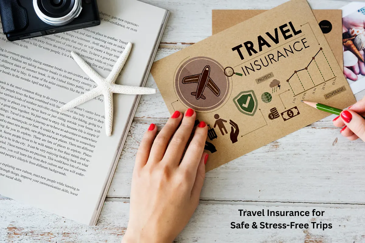 A person holding a travel insurance brochure on a wooden table with travel-related icons, a starfish, a book, and a camera, symbolizing safe and stress-free trip planning.